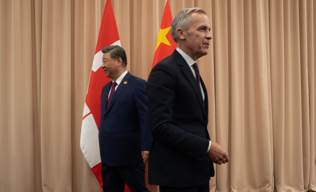 President Xi looks to the left as Carney looks to the right 
