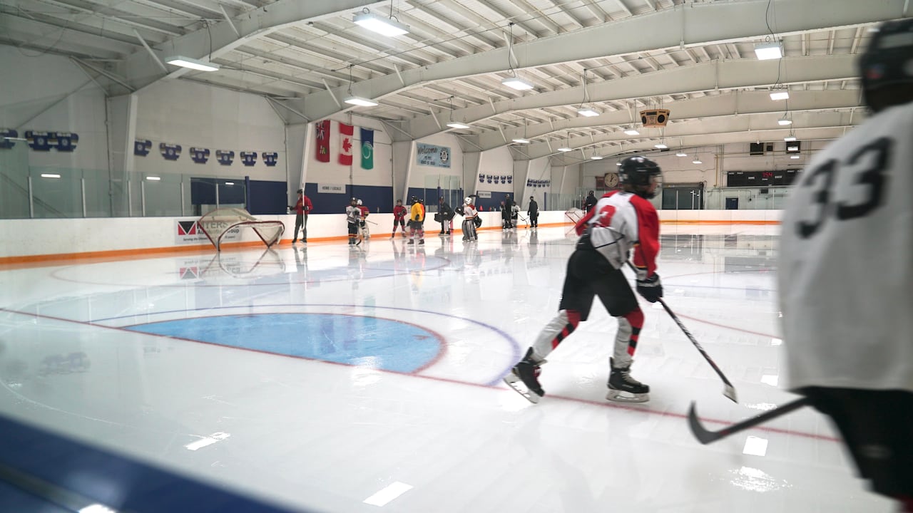 Hockey players on a rink.