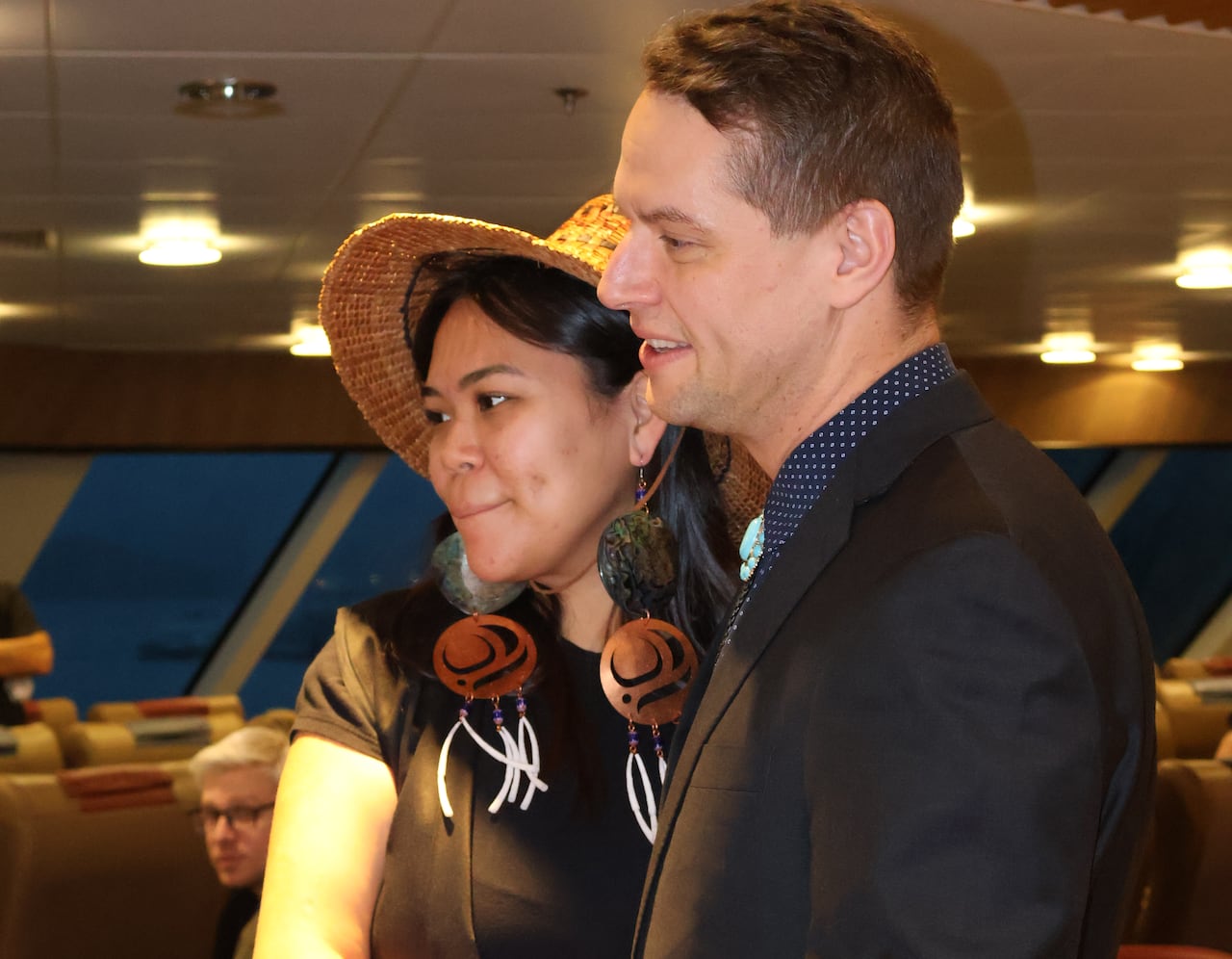 Two people embrace each other.