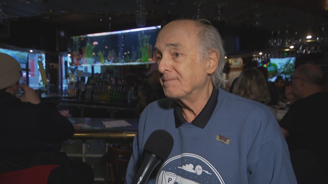 Fred Newman, owner of Imperial Pub speaks to a reporter at the bar on it's last day in service.