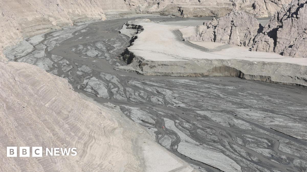 The gritty grey basin of the Amirkabir dam is empty following a drought crisis in Tehran.