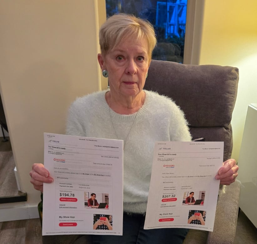 Woman sitting on armchair holding up two papers showing charges for telecom services