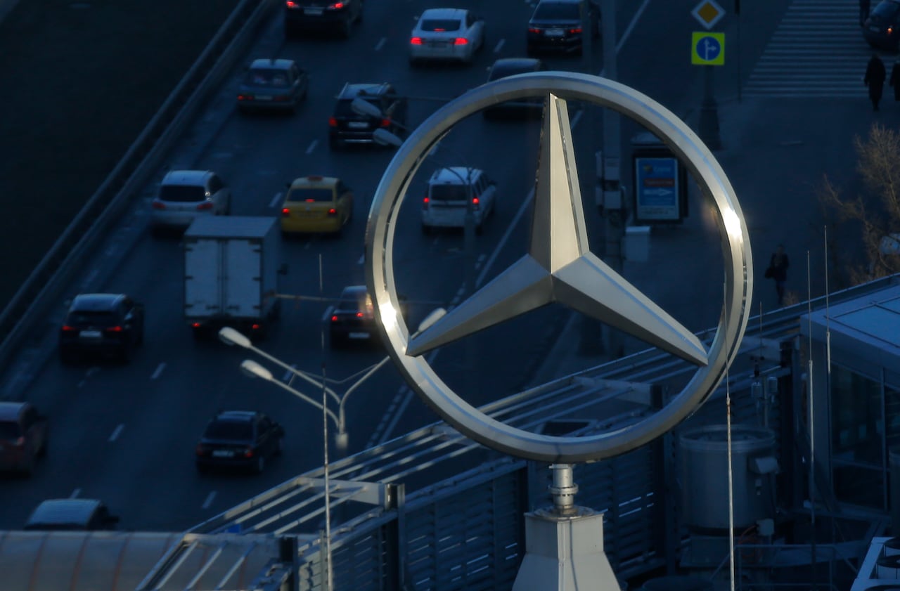 The logo of Daimler's Mercedes-Benz luxury-car division is pictured on a roof