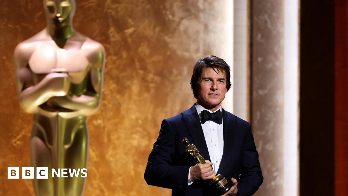 Tom Cruise wears a tuxedo and poses with his honorary Oscar during the Academy of Motion Picture Arts and Sciences 16th Governors Awards in Los Angeles on 16 November.