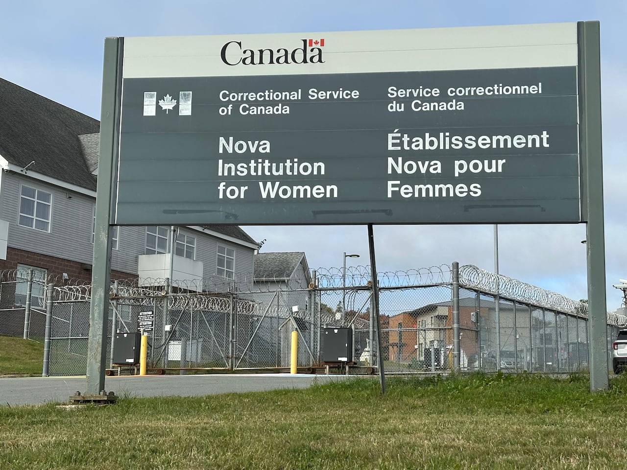 A sign that says 'Nova Institution for Women' is shown, with a chain-link fence in the background.