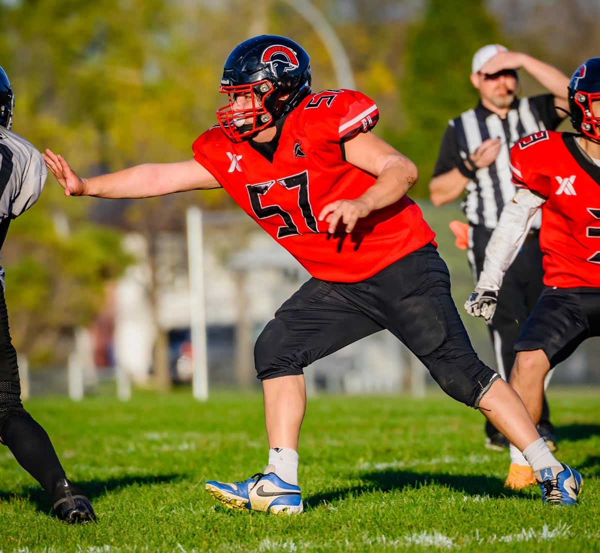 A football player in a red uniform.