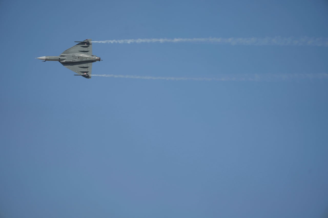 A fighter jet flying in the air.