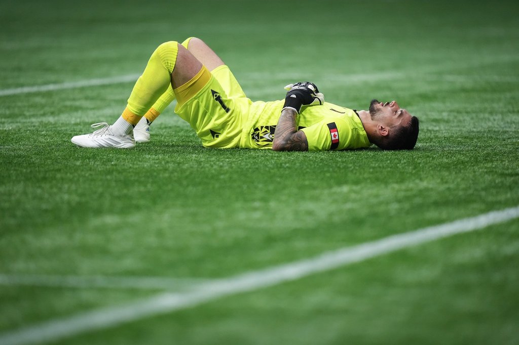 Valour FC goalkeeper Eleias Himaras lies on the field after the Vancouver Whitecaps defeated Valour FC during a Canadian Championship quarterfinal soccer match, in Vancouver, B.C., Wednesday, July 9, 2025. THE CANADIAN PRESS/Darryl Dyck