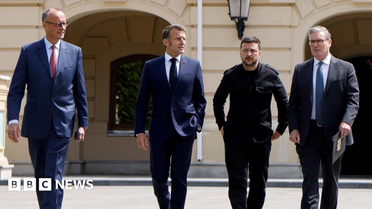 Family having a moment together messing about while winter sea swimming