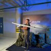 A Ukrainian man displays a military drone known as the Mini-Shark at an arms conference in Lviv, Ukraine on Aug. 28. The event highlighted Ukraine's rapidly growing weapons industry, and was held in an underground parking garage so it would not be interrupted by one of Russia's frequent air strikes.