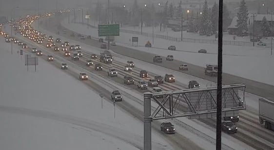 snowy freeway dawn headlights