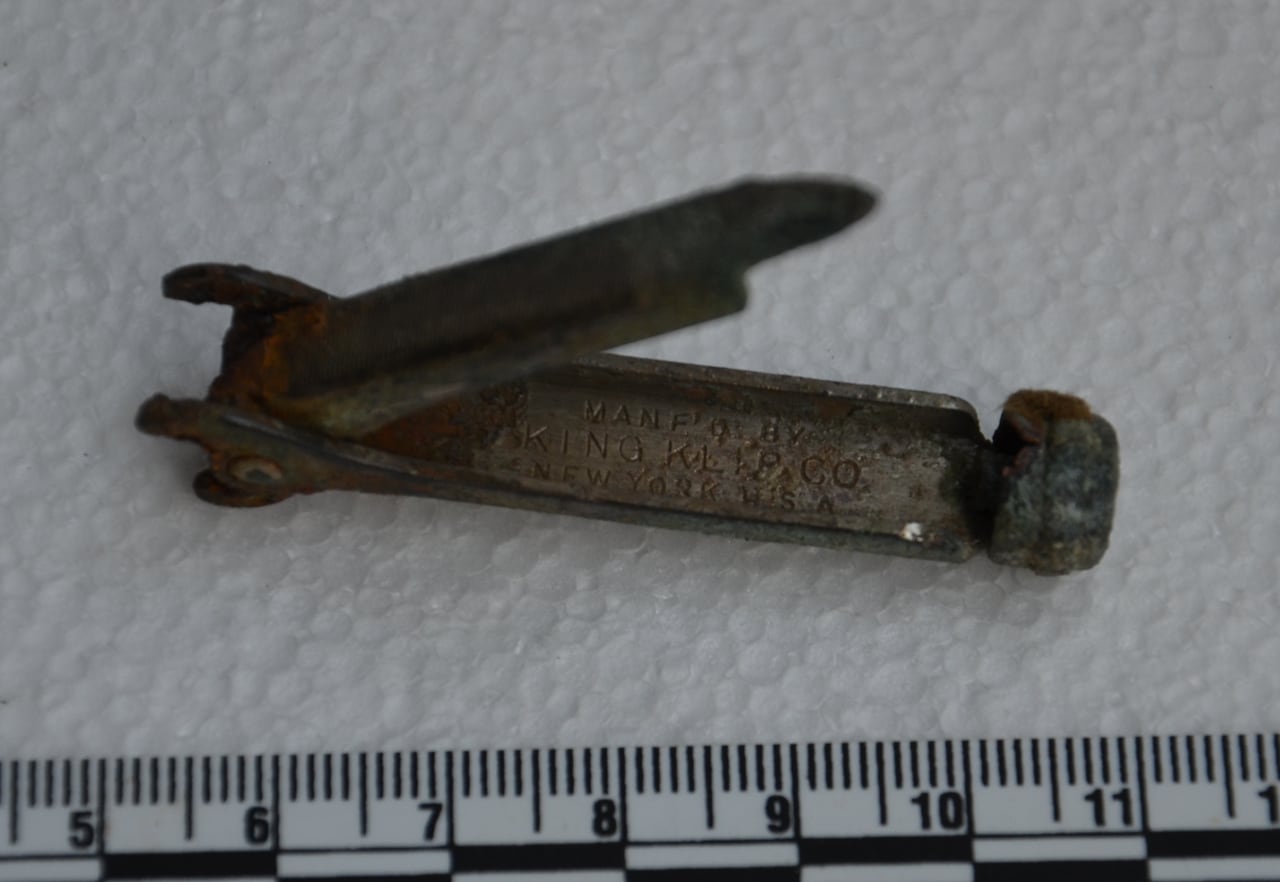 a rusted nail clipper and file grooming tool