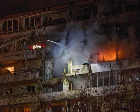 Firefighters put out the fire after a drone hit a multi-storey residential building during Russia's night drone attack in Kyiv, Ukraine.