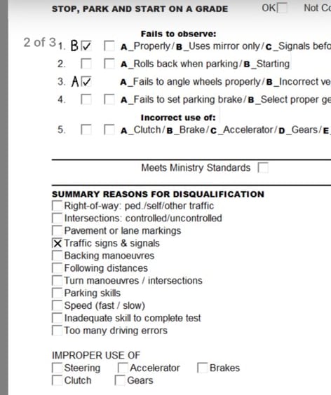 A screenshot of driving exam results with a checkmark next to "traffic, signs and signals."