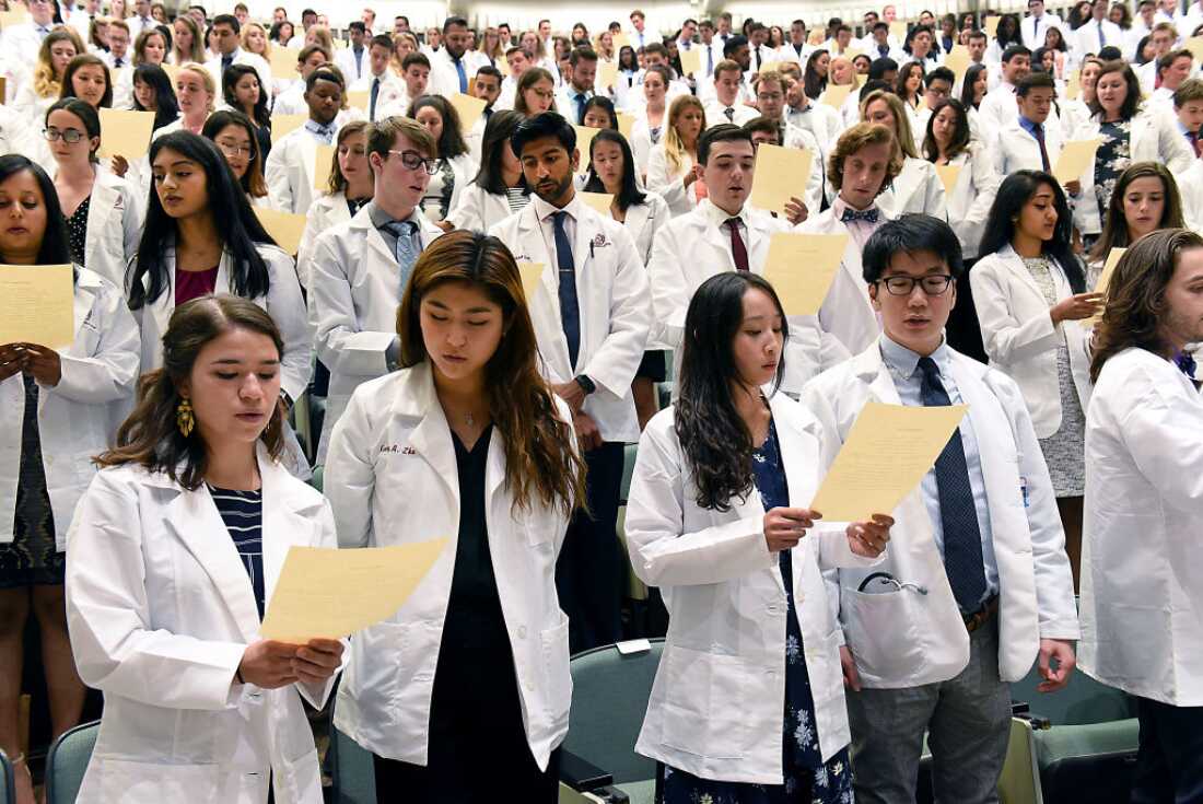Incoming medical students from the Class of 2023 recite the Hippocratic Oath during the White Coat Ceremony at Albany Medical College on Tuesday, Aug. 6, 2019 in Albany, N.Y.
