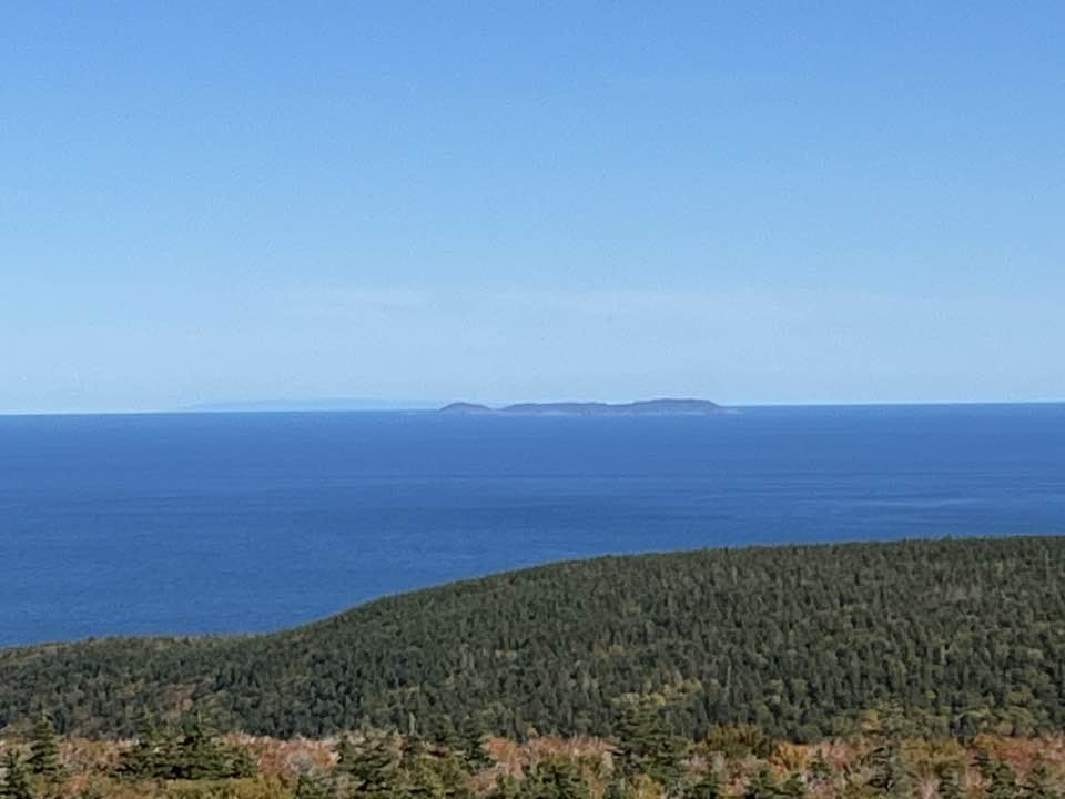 This is the photograph that hiker Wayne McKay took from the top of Meat Cove Mountain. It shows St. Paul Island near the horizon and beyond that, McKay claims the shadowy mass in the picture is Newfoundland. 