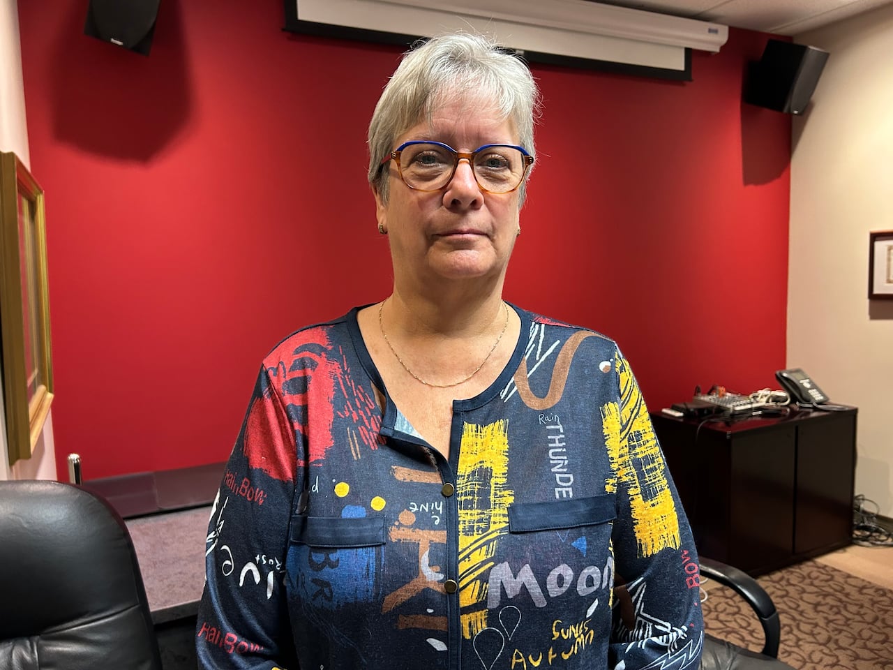 A woman looks at the camera