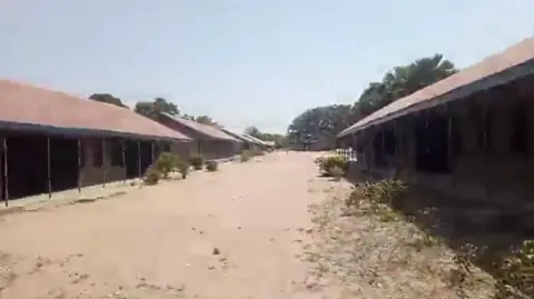 BBC Two rows of school buildings with a dirt path between them