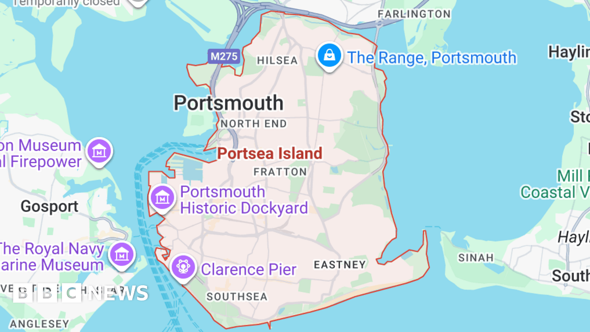 Family having a moment together messing about while winter sea swimming