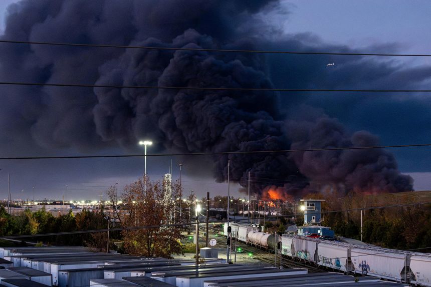 Smoke rises from the wreckage of a cargo jet after it crashed on departure from Louisville Muhammad Ali International Airport in Louisville, Kentucky, on Tuesday.