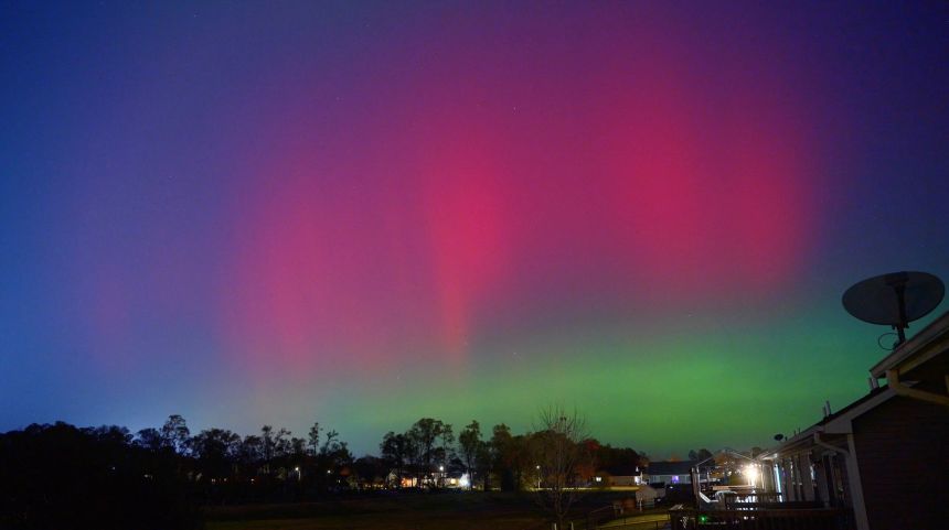 Northern lights illuminate the night sky in Johnston, Iowa.