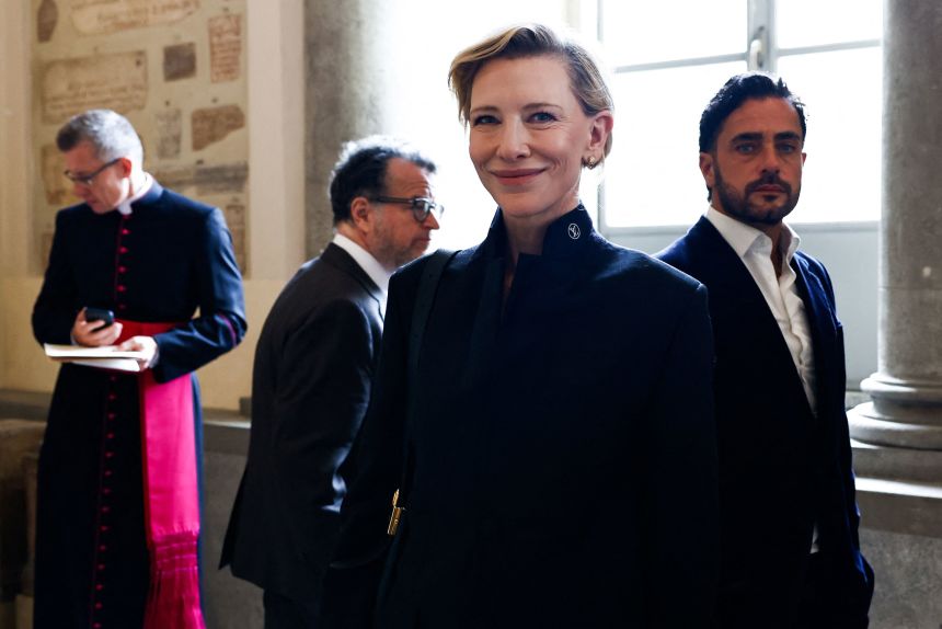 Cate Blanchett reacts in the Galleria Lapidaria of the Apostolic Palace after meeting Pope Leo.