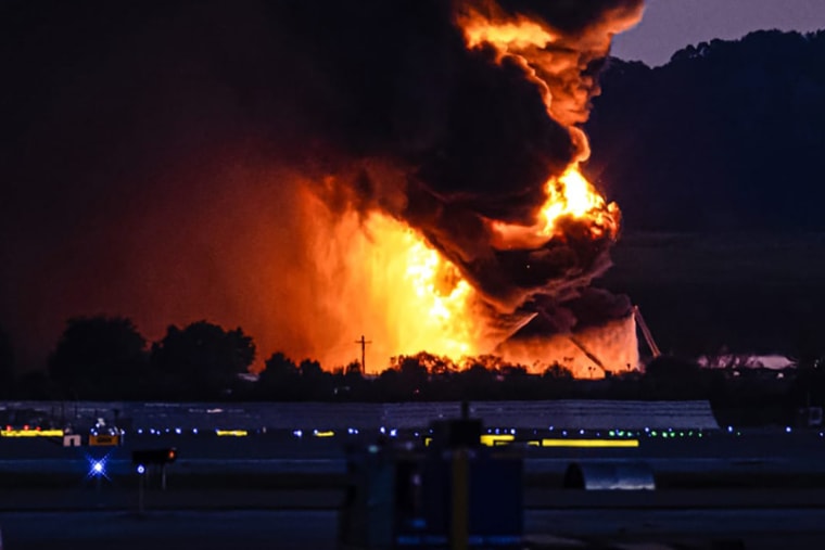 A fireball erupts near airport property after reports of a plane crash at Louisville International Airport on Nov. 4, 2025, in Louisville, Ky.