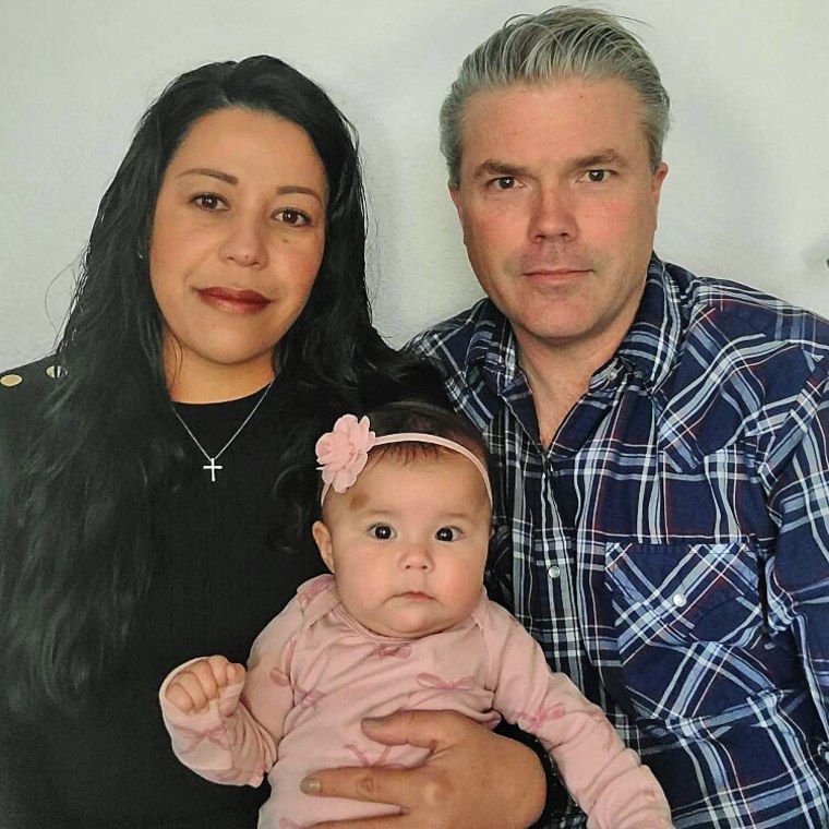 Yurany and Stephen Dexter with their daughter, Rose.