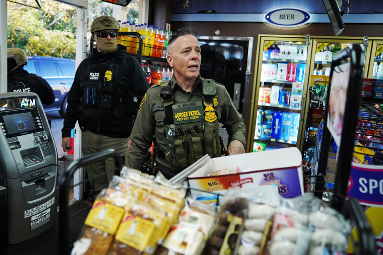 Border Patrol chief Greg Bovino walks through a gas station while searching for undocumented immigrants on Nov. 17, 2025 in Charlotte, N.C.