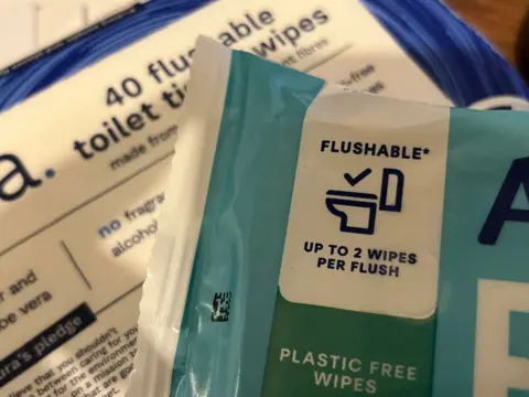 Jonah Fisher/BBC Close up of wet wipe packaging showing that they are labelled "flushable".