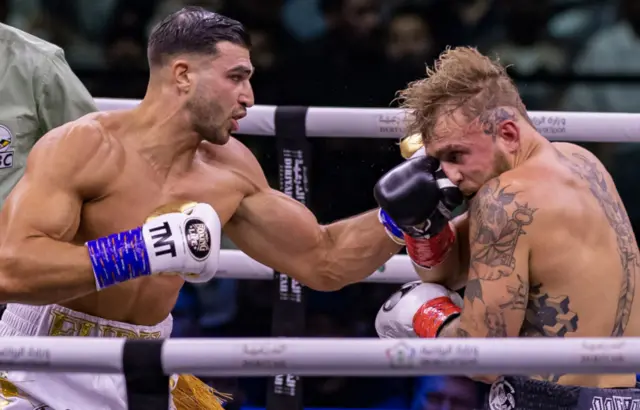 Tommy Fury lands a punch on Jake Paul