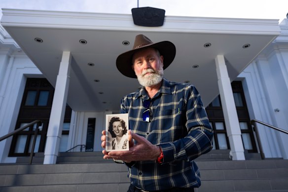 Nash with a photo of his mother, who kept her secret until she died.