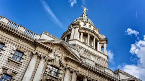 Getty Images The Old Bailey building, pictured from street level against the backdrop of a blue sky