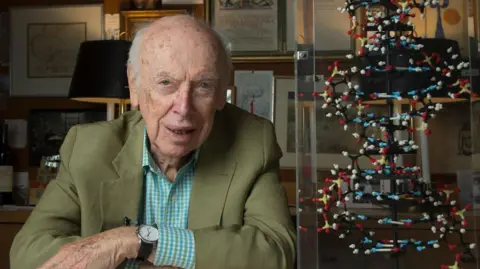 Getty Images James Watson with his famous double helix model of DNA