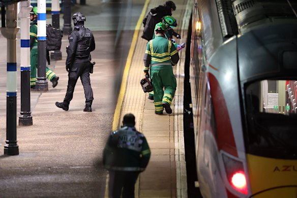 Emergency personnel inspect the train at the Huntingdon following the attack.