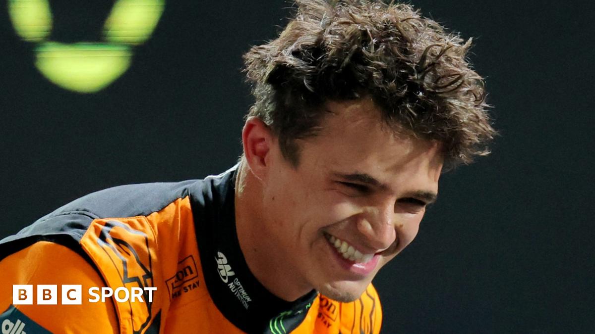 McLaren's Lando Norris leans over and smiles after taking pole position for the Las Vegas Grand Prix