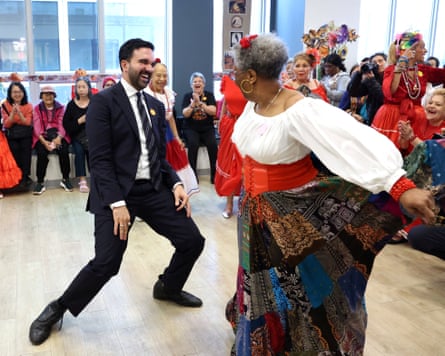Democratic candidate for New York City Mayor, Zohran Mamdani, campaigns in Manhattan, New York CityDemocratic candidate for New York City Mayor, Zohran Mamdani, dances with a supporter while campaigning at a senior center in Manhattan's Lower East Side neighborhood of New York City, U.S., October 31, 2025.  REUTERS/Brendan McDermid