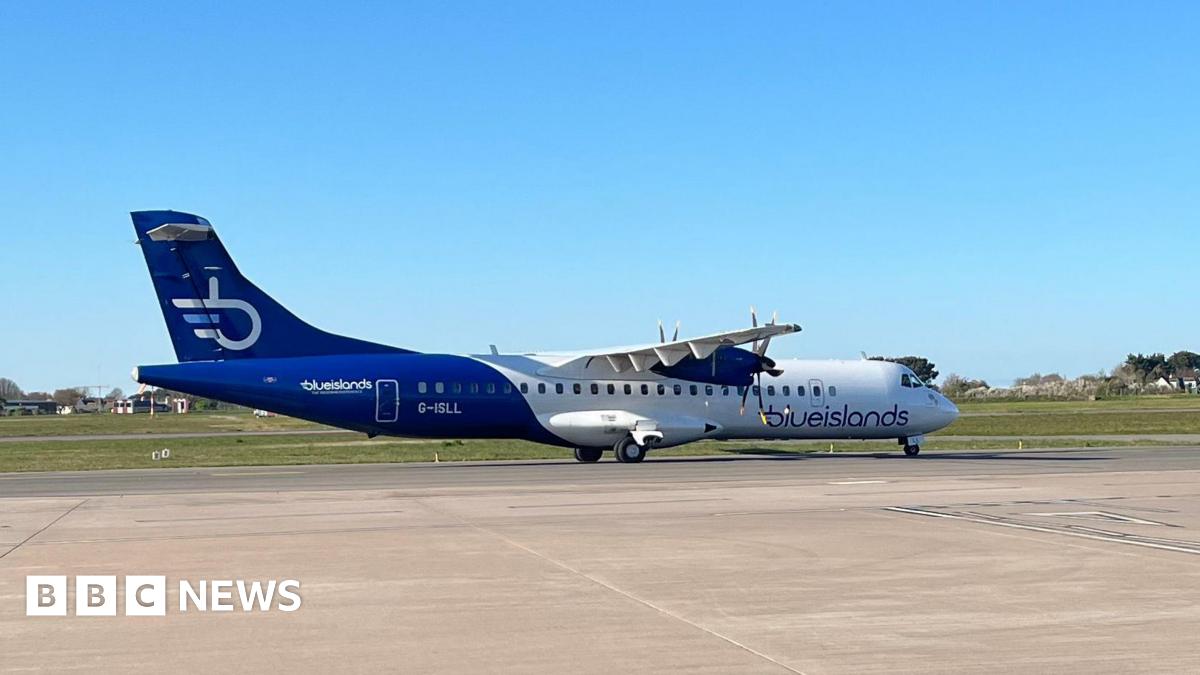 A Blue Islands plane on the tarmac at an airport. The plane is blue and white.