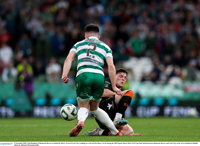 Josh Honohan is tackled by Harry Nevin. Pic: Michael P Ryan/Sportsfile