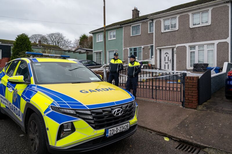 Guards outside the property in Hollyville, Hollyhill which was last night the scene of a fatal stabbing. Picture: Chani Anderson