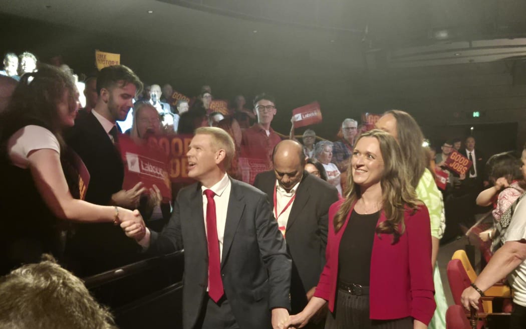 Labour leader Chris Hipkins shook people's hands as he walked out of the theatre hand in hand with his fiancé Toni Grace.