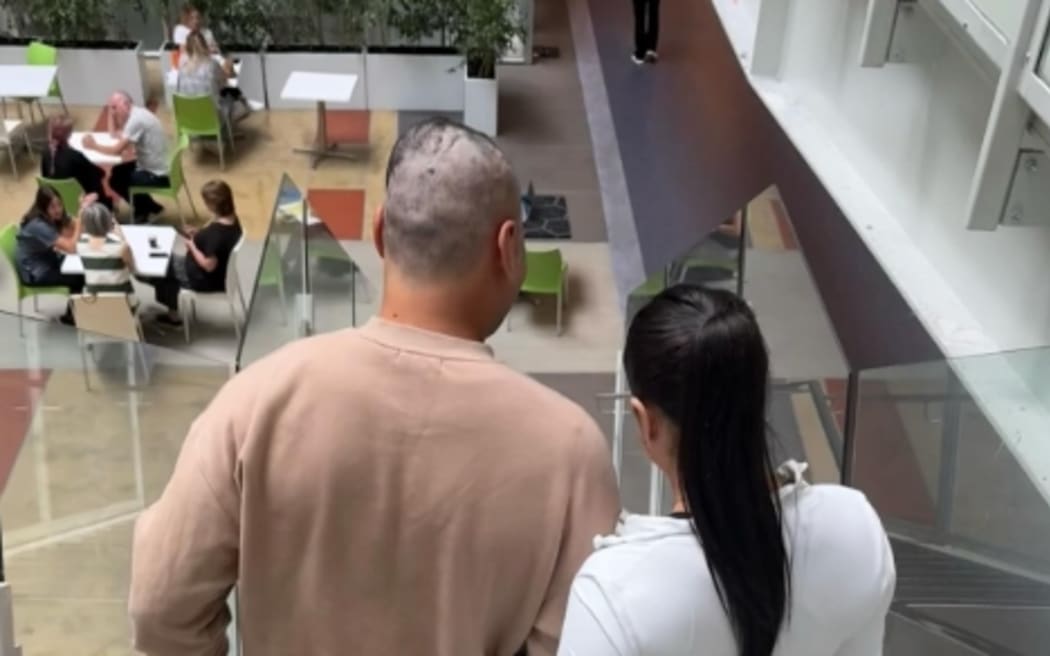 Eli Katoa has posted this photo of his partner Tuitofa Aloua helping him downstairs at hospital.