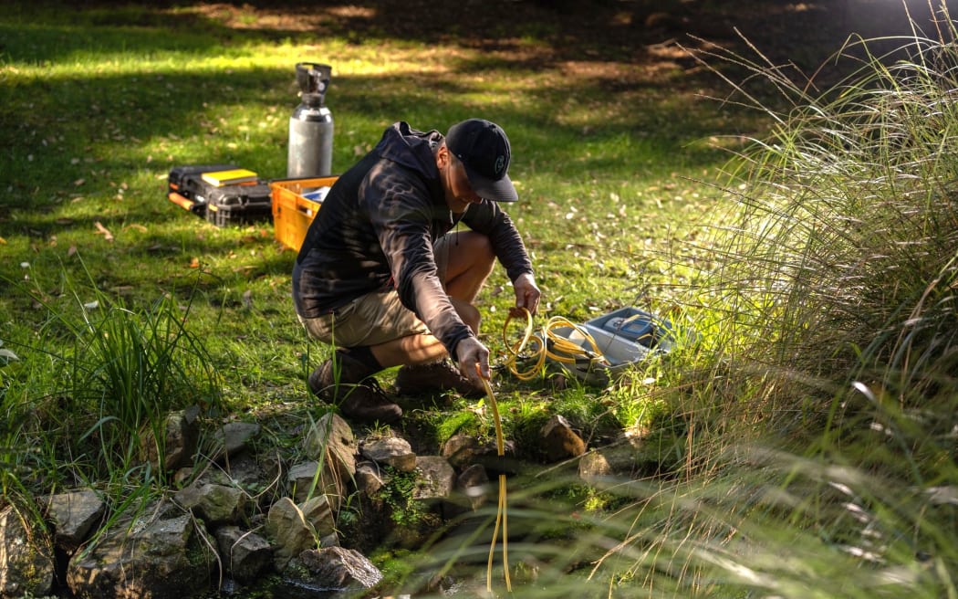 Programme co-lead Uwe Morgenstern sampling a spring.