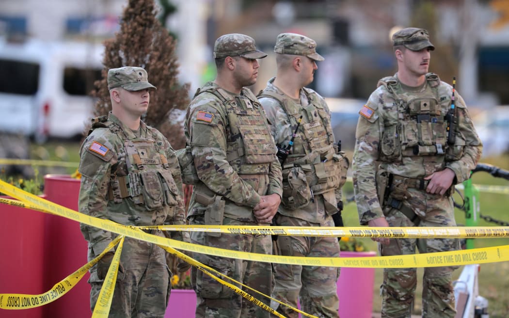 WASHINGTON, DC - NOVEMBER 26: National Guard soldiers respond to a shooting near the White House on November 26, 2025 in Washington, DC. At least two National Guardsmen have been shot blocks from the White House. According to reports, a suspect is being detained at a local hospital.   Chip Somodevilla/Getty Images/AFP (Photo by CHIP SOMODEVILLA / GETTY IMAGES NORTH AMERICA / Getty Images via AFP)
