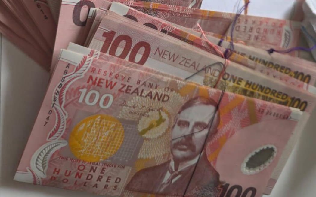 A cleaner tidying up some dusty old chairs at a Wellington property has stumbled across $20,000 cash.