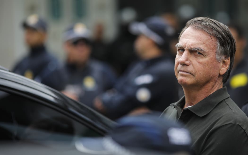 Former Brazilian President (2019-2022) Jair Bolsonaro leaves the DF Star hospital in Brasilia on September 14, 2025, after undergoing a series of medical examinations, as he remains under house arrest. Brazil's Supreme Court on September 11 sentenced firebrand ex-president Jair Bolsonaro to 27 years in prison for coup plotting at the end of a landmark trial that divided the nation and drew US fury. (Photo by Sergio Lima / AFP)