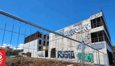 Neighbour wins $30k payout over half-done, 'blight' of an apartment block in Auckland