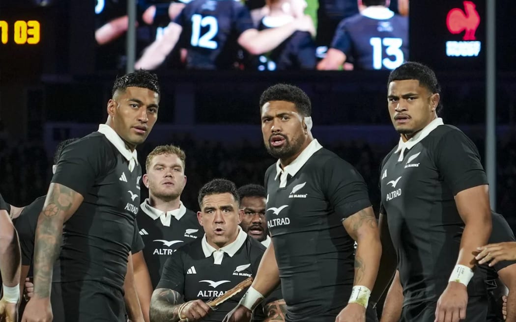 The All Blacks perform the haka against France.