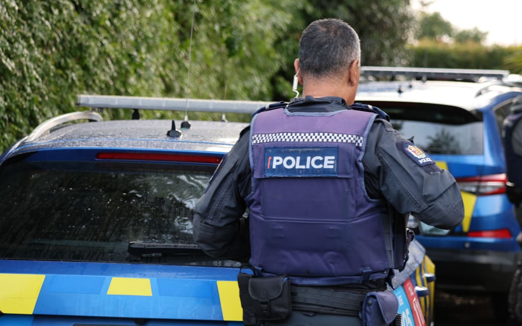 A police officer investigates alleged crime in Northland.