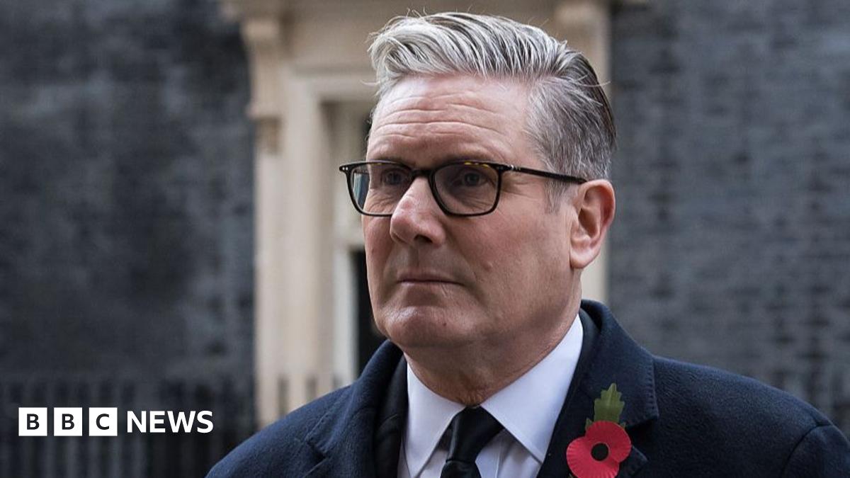 Keir Starmer outside Downing Street, wearing a poppy on his dark suit